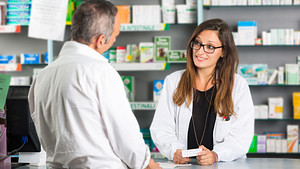 Male customer speaking to a pharmacist