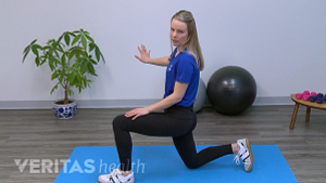 Woman doing a hip flexor stretch.